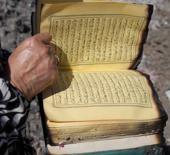 Kül olan evlerinden tek yanmayan: Kur'an-ı Kerim