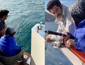 Burak Özçivit'ten baba-oğul günü! Karan ile denize açılıp balık tuttular