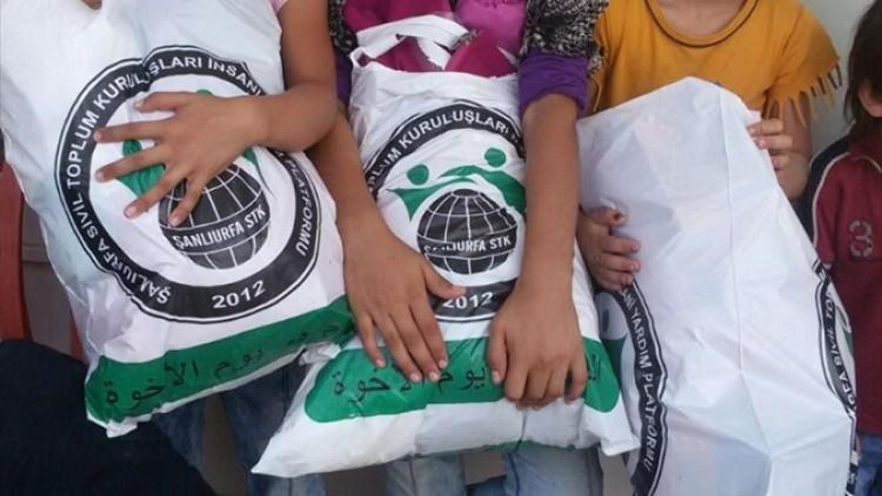 Suriyeli yetim ve öksüzlere kıyafet yardımı