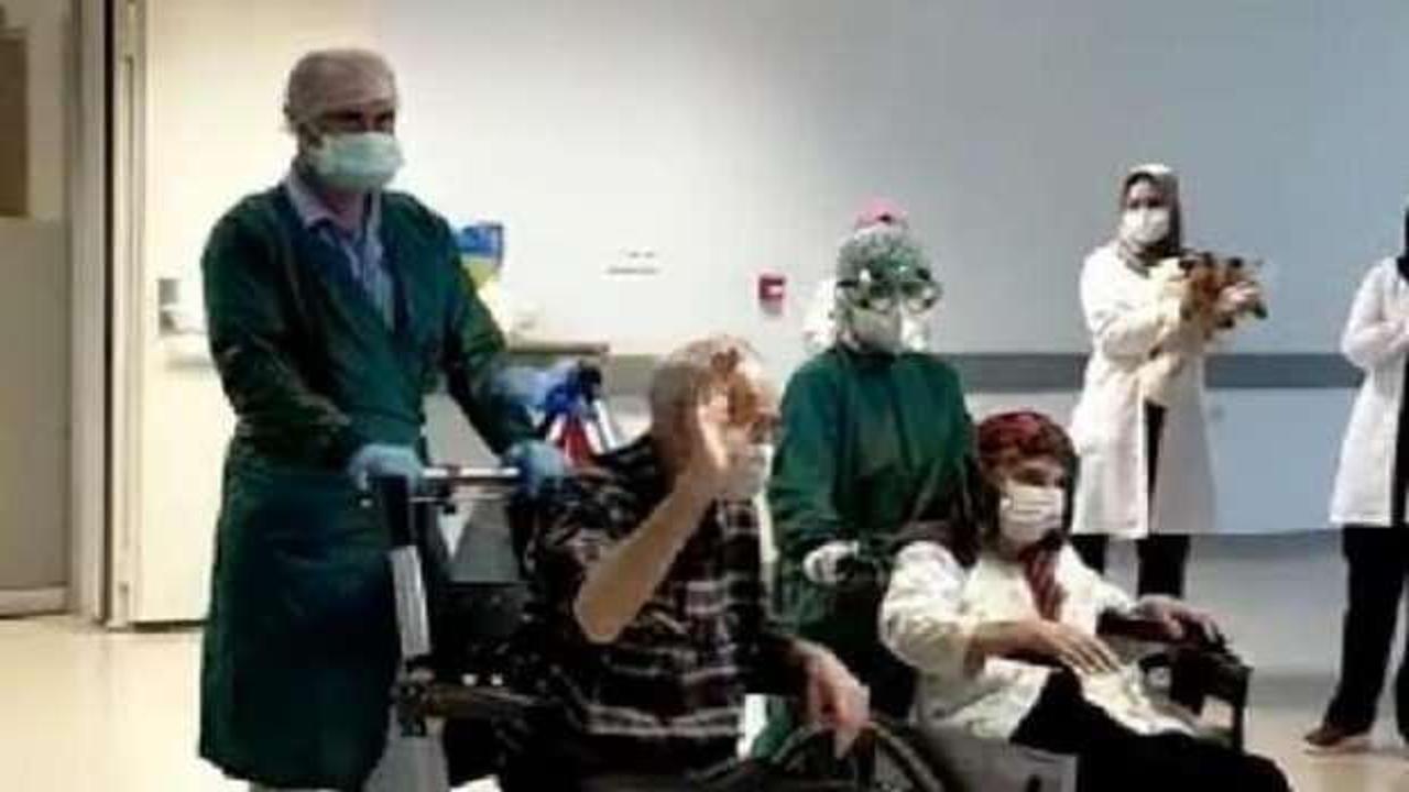 Koronavirüsü yenen 82 yaşındaki çift alkışlarla taburcu edildi