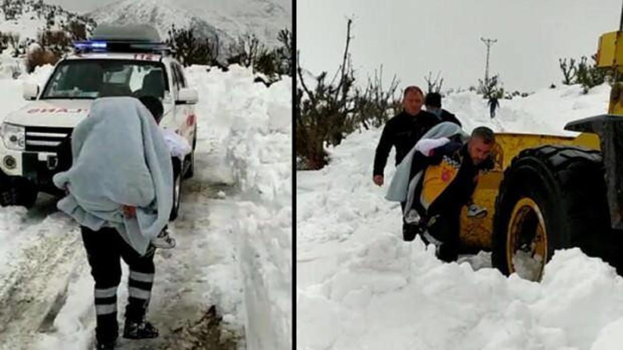 Kolu yanan &ccedil;ocuğu, karla kapalı yolda sırtta taşıdılar