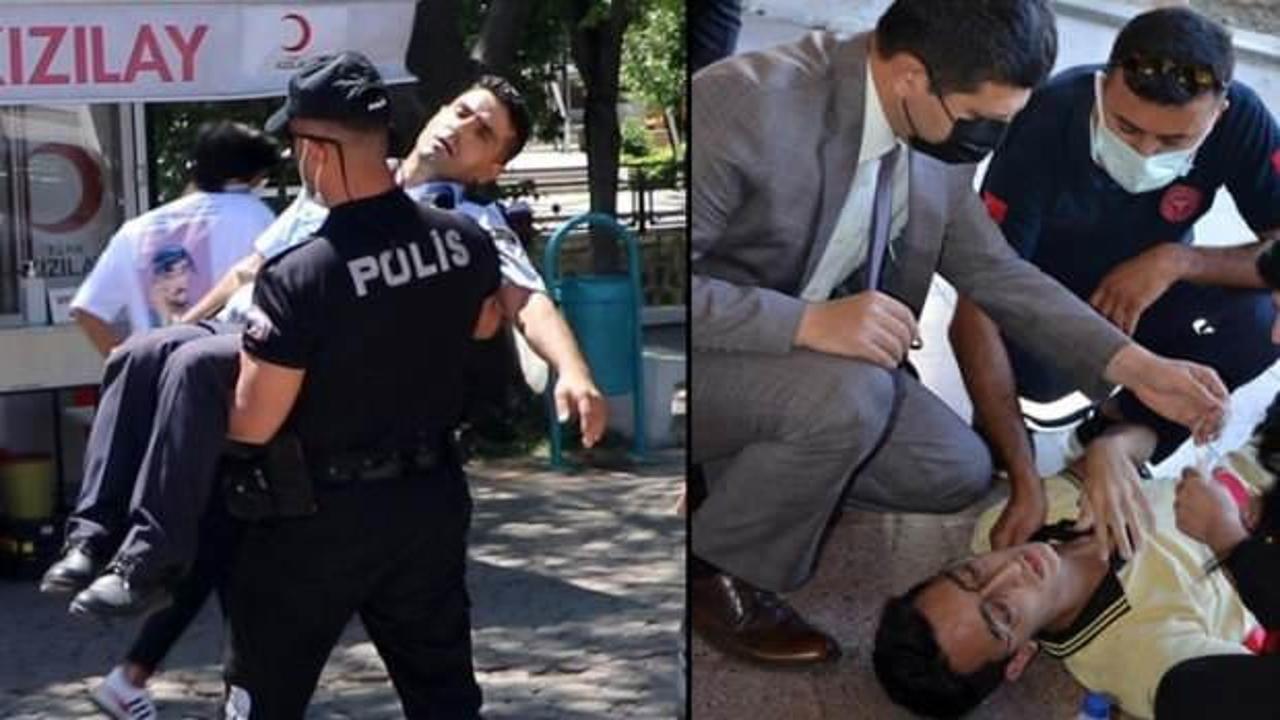 Törende bayılan zabıtayı polis kucağında taşıdı