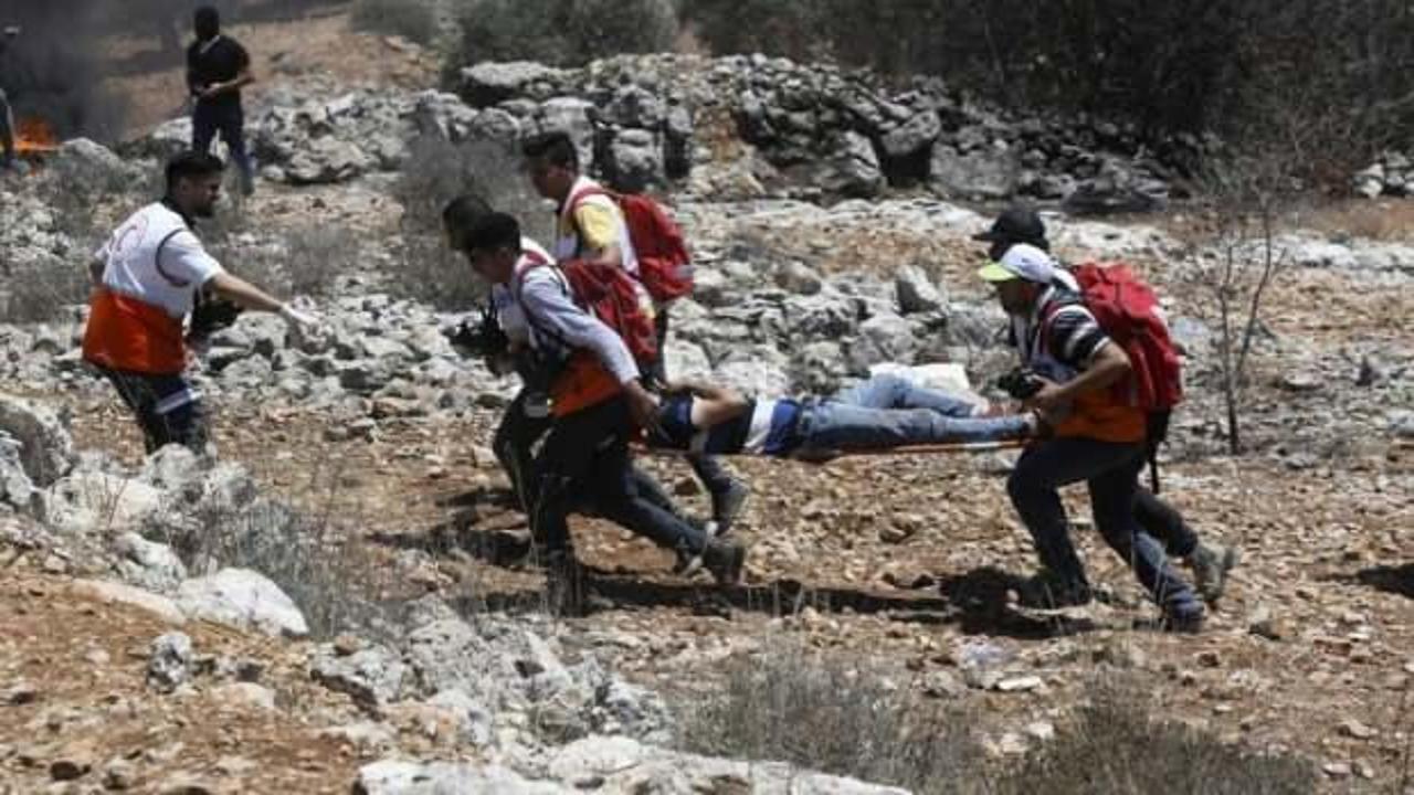 İsrail güçlerinin Filistinlilere gerçek mermili müdahalesinde 411 kişi yaralandı
