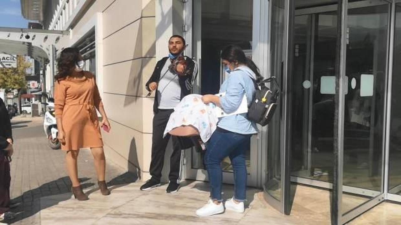 Müzisyen baba taburcu olan bebeğini hastane kapısında kemanla karşıladı