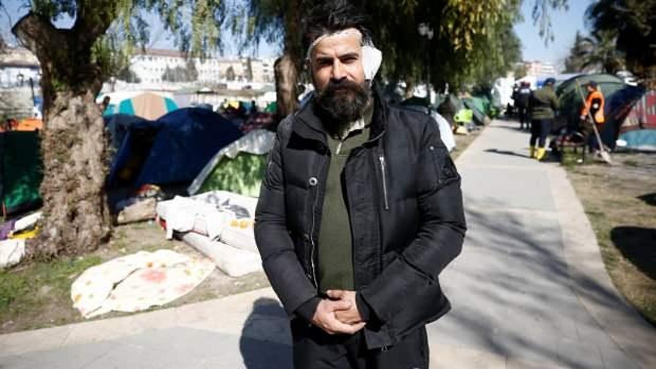 Başı dumanlı AFAD g&ouml;n&uuml;ll&uuml;s&uuml;, kulağı kopmasına rağmen m&uuml;cadeleyi bırakmıyor