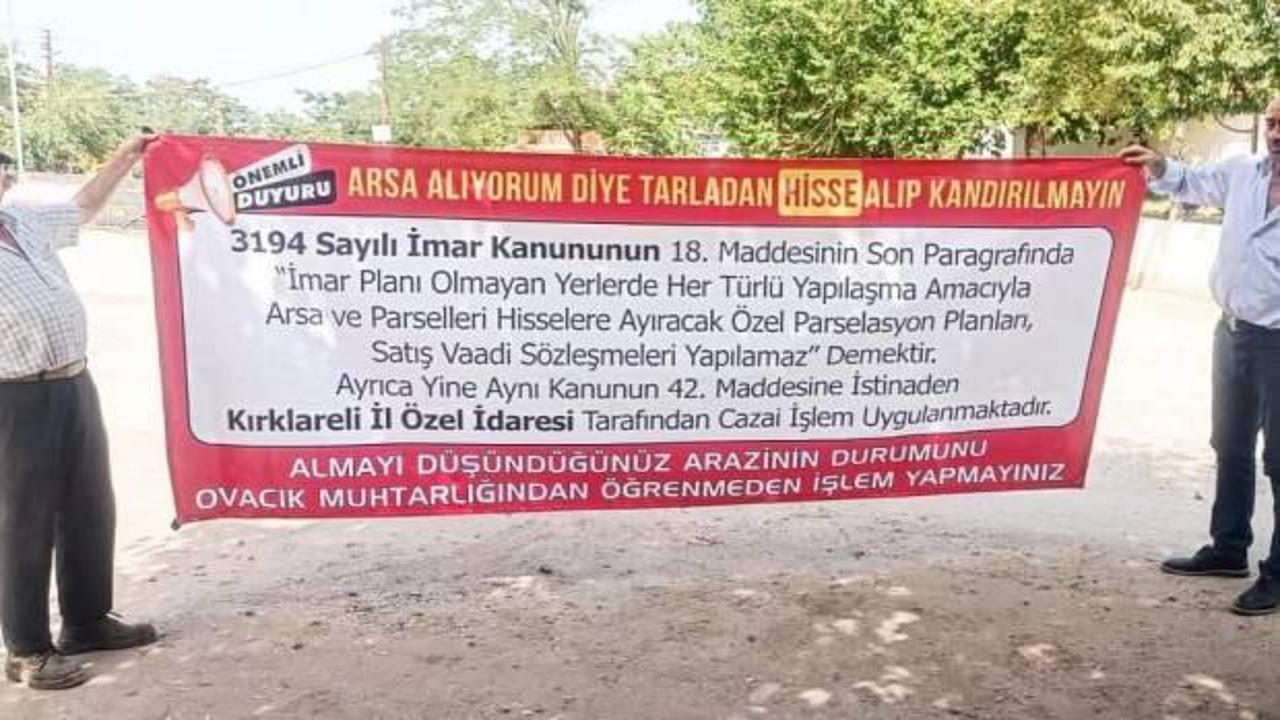 Köy muhtarından arsa alanlara pankartlı uyarı