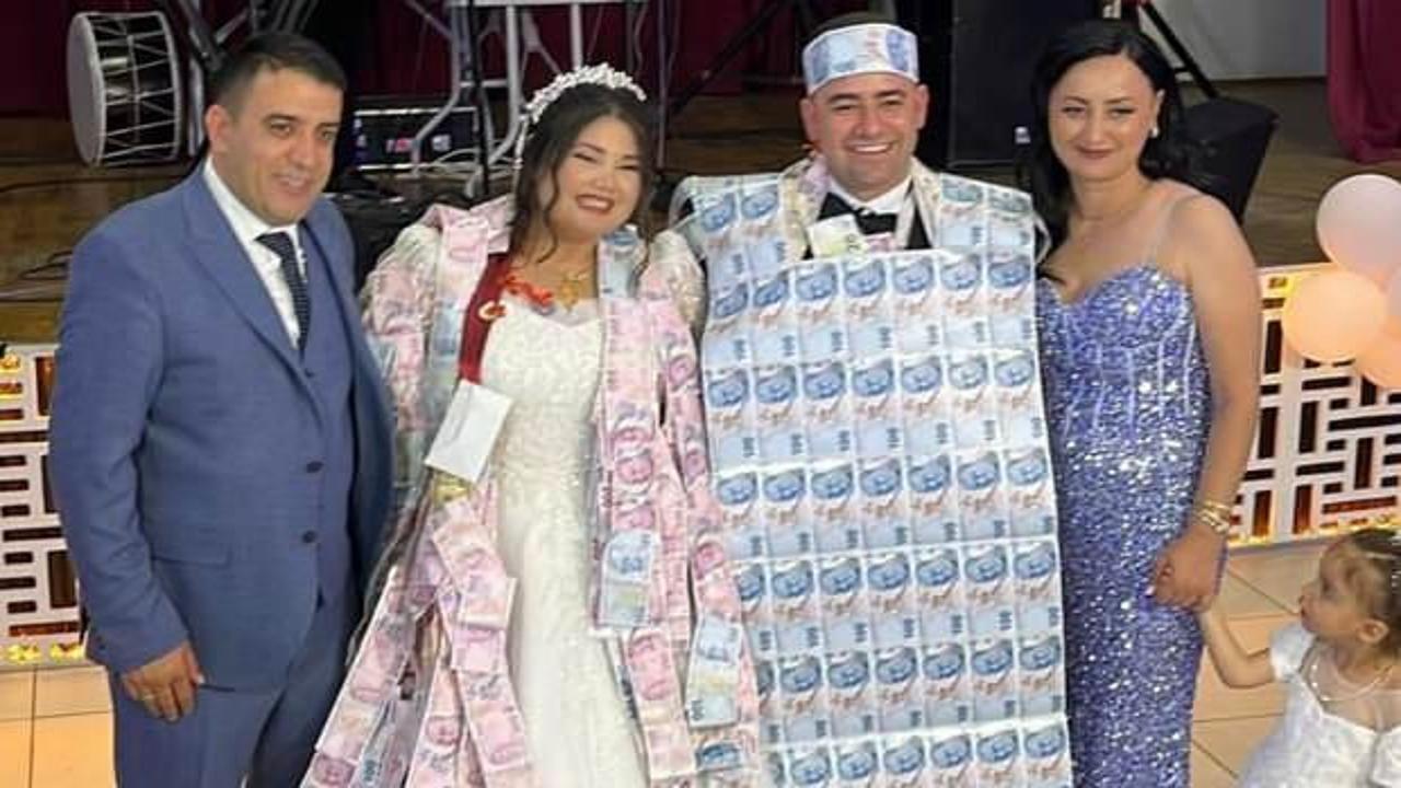 Düğünde gülümseten anlar: Damada paradan ceket giydirdiler!
