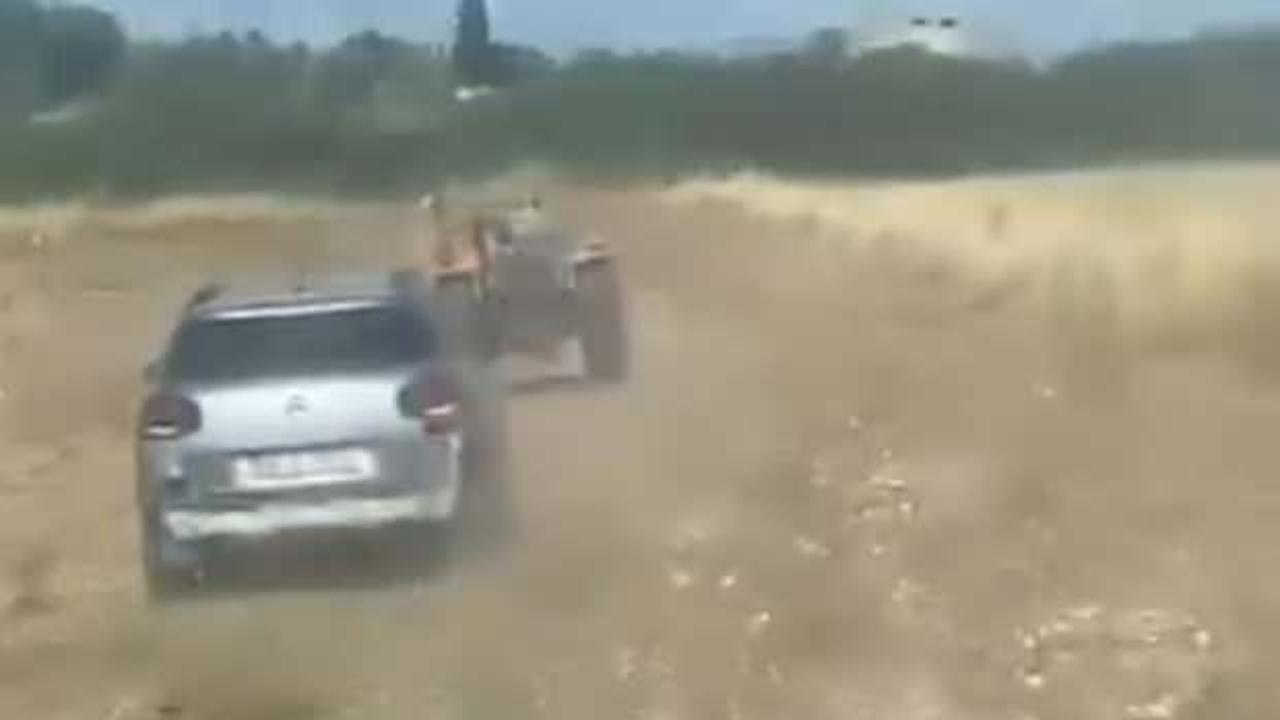 Otomobil ve traktörün nefes kesen kovalamacası!