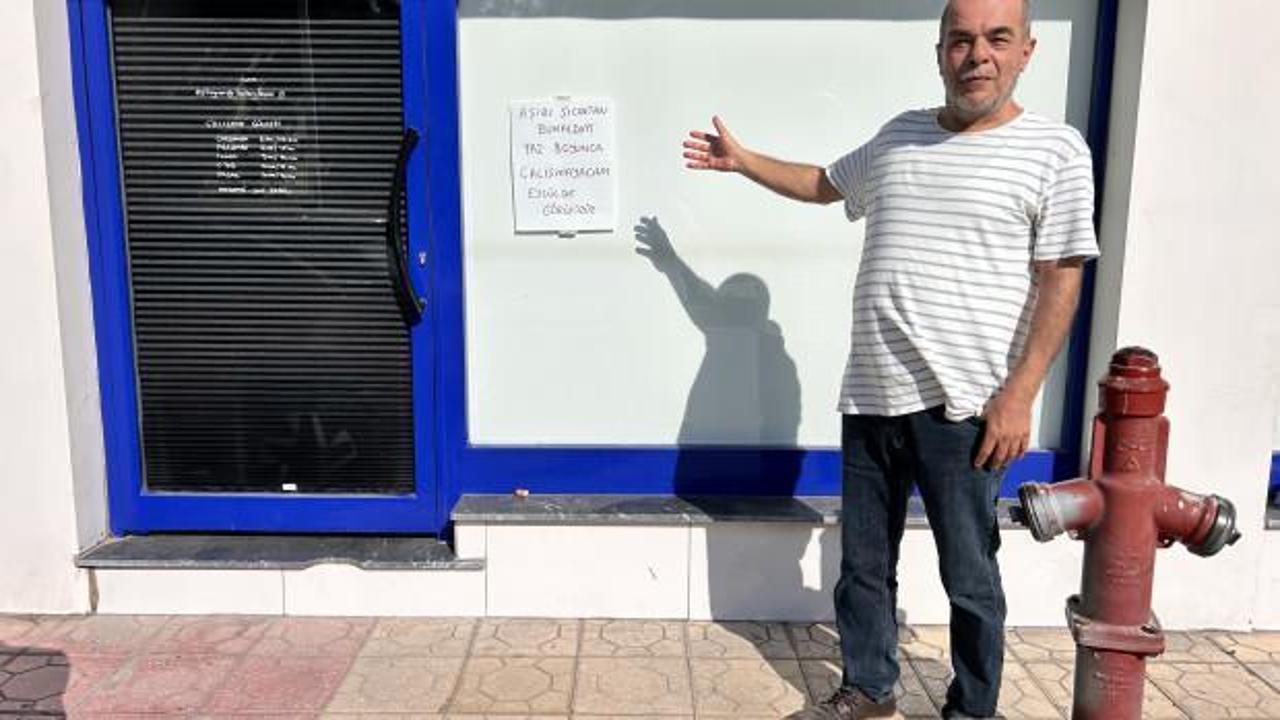 Sıcaklardan bunalan adamın iş yerine astığı not güldürdü!