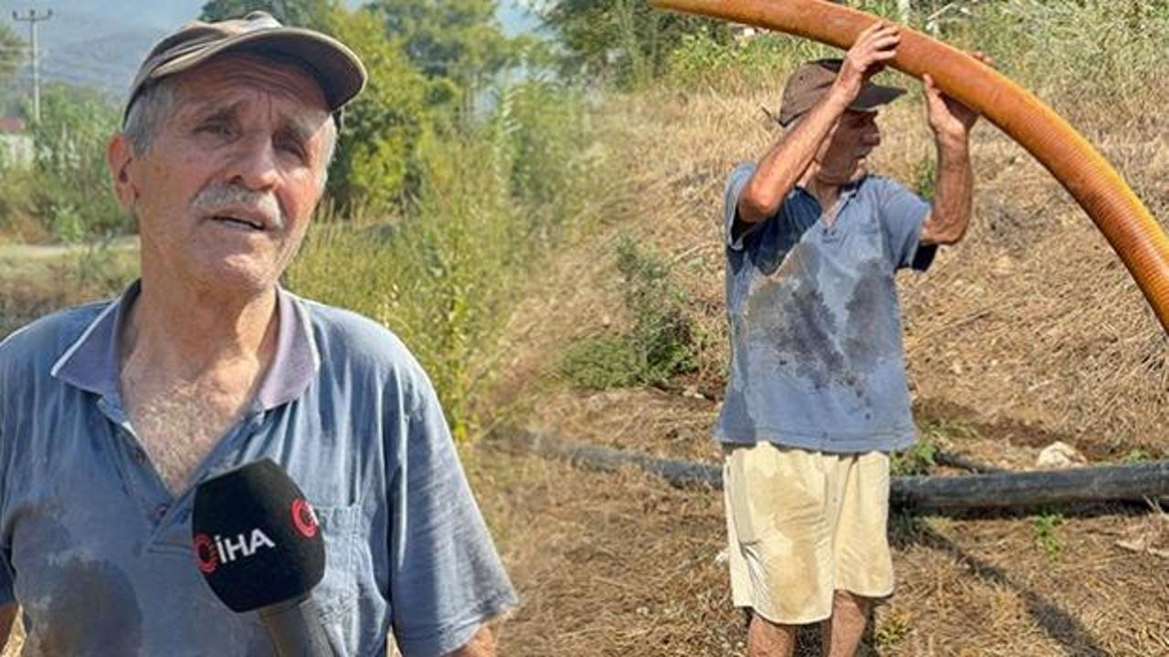Kanser hastası Nazmi Kundakçı'nın yangın söndürme ekiplerine su taşıdığı an.