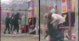Genç kızı parkta saçlarından tutup tekme tokat dövdü!