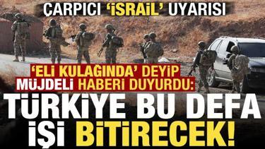 'Eli kulağında'