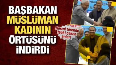 Başbakan M&uuml;sl&uuml;man kadının &ouml;rt&uuml;s&uuml;n&uuml; indirdi! Hindistan'da tepki &ccedil;eken anlar