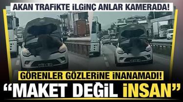 Bursa'da seyir halindeki otomobilin kaputunu a&ccedil;arak tamir yaptı