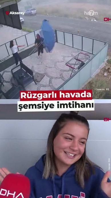 Gen&ccedil; kızın r&uuml;zgarlı havada şemsiye ile imtihanı!