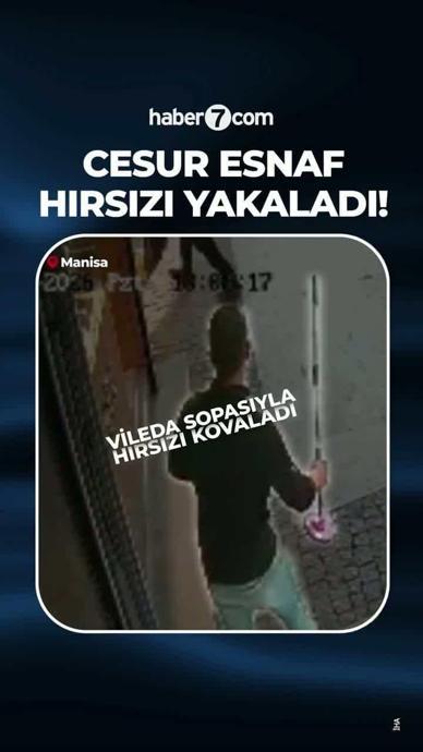 Cesur esnaf hırsızın ka&ccedil;masına izin vermedi!